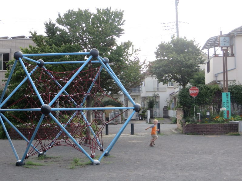 Liam took a few minutes to explore a small playground along our route.